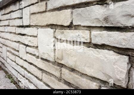 Cream colored brick wall with leading lines and natural texture. Stock Photo