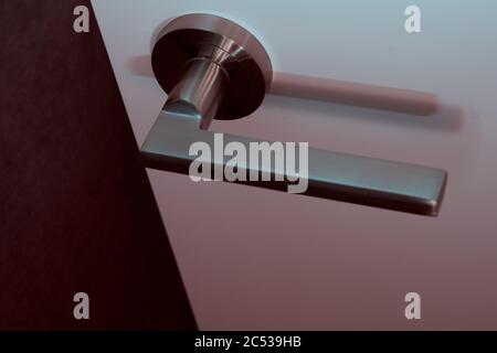 Open door with doorknob. Dangerous room concept. Stock Photo
