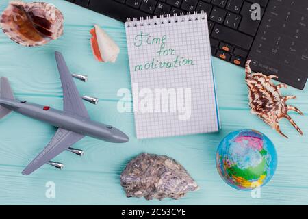 Time for motivation words on notebook in traveling composition. Stock Photo