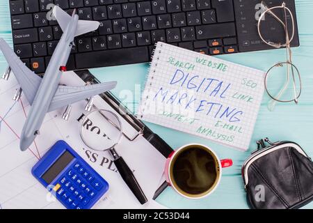 Digital marketing on notepad and various office supplies Stock Photo