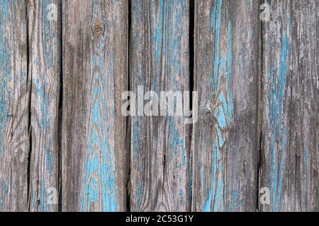 Close up of weathered and worn wooden panel with blue flaking paint Stock Photo
