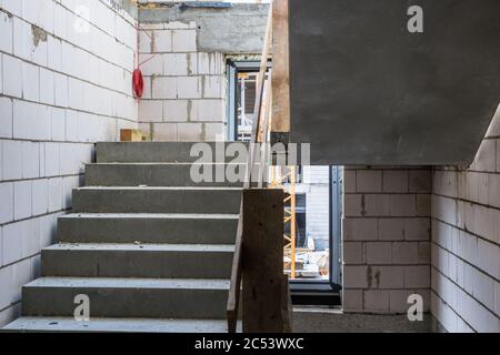 Construction works, Interior of the building under construction, Stairs Stock Photo
