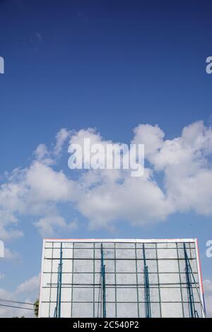 The back of an advertising billboard against a blue sky Stock Photo