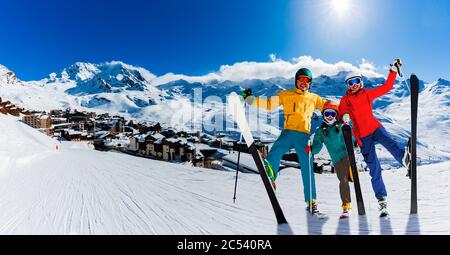 Ski in winter season, view from ski run at mountains and Val Thorens resort in sunny day in France, Alps. Stock Photo