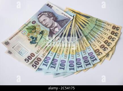 Many 500, 100 and 50 RON or lei romanian banknotes on white background. Romanian currency. Stock Photo