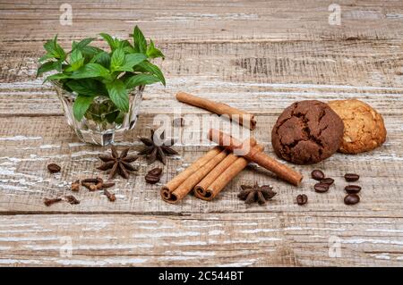 Fragrant spices and homemade cookies on a wooden background. Stock Photo