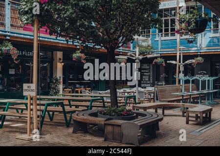 London, UK - June 13, 2020: Empty tables inside Kingly Court, a three-storey alfresco food and dining courtyard in the heart of London West End. Selec Stock Photo