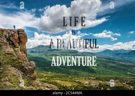 Inspirational motivational quote on the nature background. Text: Life is a beautiful adventure. Positive quote and beautiful mountain landscape. Conce Stock Photo