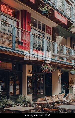 London, UK - June 13, 2020: Empty tables inside Kingly Court, a three-storey alfresco food and dining courtyard in the heart of London West End. Selec Stock Photo