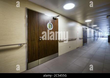 Moscow - July 25, 2017: Corridor in a modern hospital with wooden doors Stock Photo