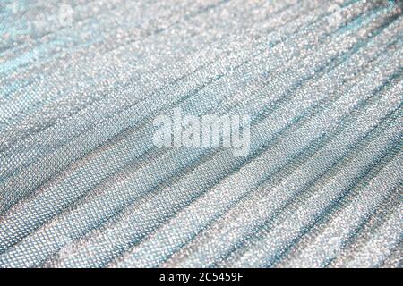 Metal glitter silver cloth background, close up. Trendy Metallic grey fabric texture. Gray sequins, sparkling sequined textile.Gray decorative Stock Photo