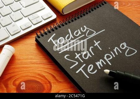 Note in the notebook. Today Start temping. Search for temporary work. Stock Photo