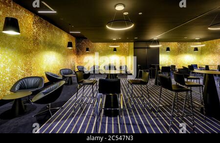 Moscow - July 21, 2014: Interior of cafe in the cinema. Panorama of the modern interior with black and yellow design. Stock Photo