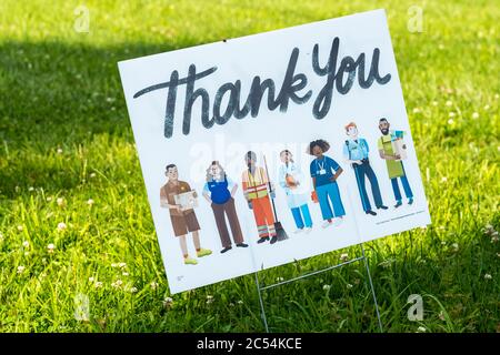 Worcester, PA - June 6, 2020: This thank you sign on a green lawn thanks essential workers during the corona virus pandemic. Stock Photo