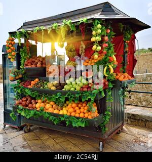 Selling fresh fruits and vegetables on the streets of Acre in Israel at morning Stock Photo