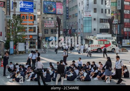 Japanese high school student at Shinagawa Station square, Tokyo, Japan. Stock Photo