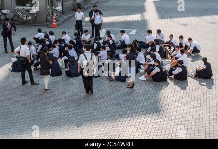 Japanese high school student at Shinagawa Station square, Tokyo, Japan. Stock Photo