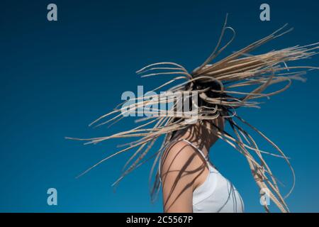 Beautiful woman waving hair with stylish afro braids Stock Photo