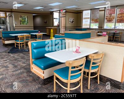 Orlando, FL/USA - 6/5/20:  A Wendy's interior with social distancing information on the tables. Stock Photo