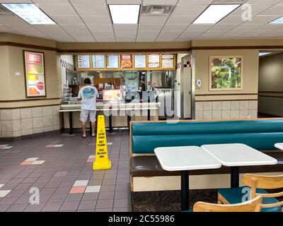 Orlando, FL/USA - 6/5/20:  A Wendy's interior with social distancing information on the tables. Stock Photo