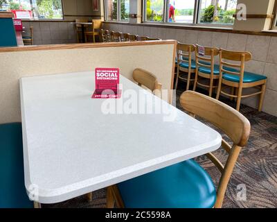 Orlando, FL/USA - 6/5/20:  A Wendy's interior with social distancing information on the tables. Stock Photo