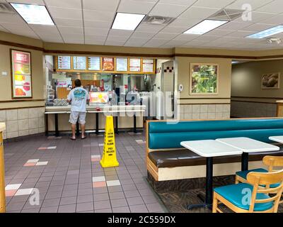 Orlando, FL/USA - 6/5/20:  A Wendy's interior with social distancing information on the tables. Stock Photo