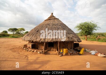 A traditional thatched hut in an indigenous, ethnic Hamer (Hamar) tribe village. Turmi, Omo Valley, Ethiopia. Stock Photo
