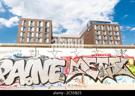 Hotel Indigo, facade, East Side Gallery, wall painting, graffiti former Berlin Wall, Friedrichshain, Berlin, Germany Stock Photo