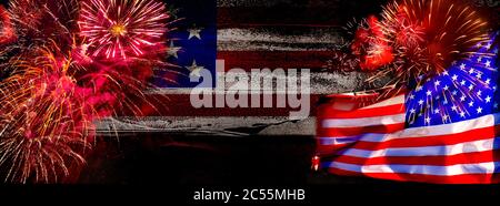 American Celebration - Us Flags And Fireworks on dark background and place for text Stock Photo