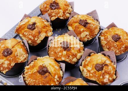 baked chocolate muffins in a metal tray Stock Photo