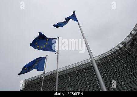 Brussels, Belgium. 30th June, 2020. Flags of the EU fly in front of the headquarters of the European Commission in Brussels, Belgium, June 30, 2020. The Council of the European Union (EU) on Tuesday adopted a recommendation to lift entry restrictions for residents of some third countries starting Wednesday, and the United States is noticeably shut out. Credit: Zheng Huansong/Xinhua/Alamy Live News Stock Photo