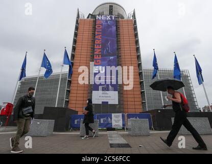 Brussels, Belgium. 30th June, 2020. People walk past the headquarters of the European Commission in Brussels, Belgium, June 30, 2020. The Council of the European Union (EU) on Tuesday adopted a recommendation to lift entry restrictions for residents of some third countries starting Wednesday, and the United States is noticeably shut out. Credit: Zheng Huansong/Xinhua/Alamy Live News Stock Photo