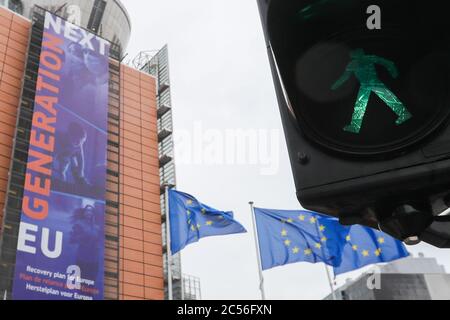 Brussels, Belgium. 30th June, 2020. A green light is seen in front of the headquarters of the European Commission in Brussels, Belgium, June 30, 2020. The Council of the European Union (EU) on Tuesday adopted a recommendation to lift entry restrictions for residents of some third countries starting Wednesday, and the United States is noticeably shut out. Credit: Zheng Huansong/Xinhua/Alamy Live News Stock Photo