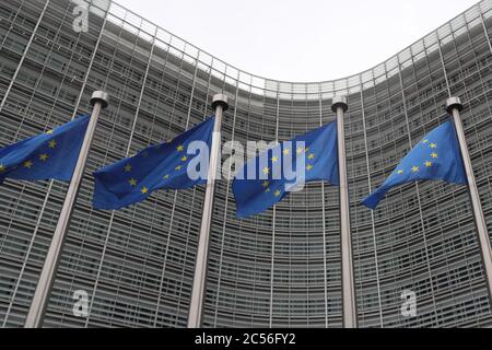 Brussels, Belgium. 30th June, 2020. Flags of the EU fly in front of the headquarters of the European Commission in Brussels, Belgium, June 30, 2020. The Council of the European Union (EU) on Tuesday adopted a recommendation to lift entry restrictions for residents of some third countries starting Wednesday, and the United States is noticeably shut out. Credit: Zheng Huansong/Xinhua/Alamy Live News Stock Photo