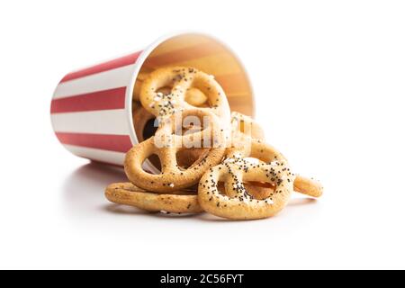 Crispy salted pretzels in paper cup isolated on white background Stock Photo