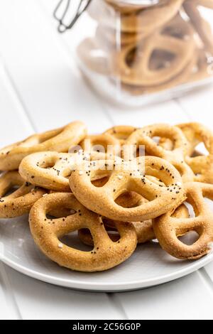 Crispy salted pretzels on plate. Stock Photo
