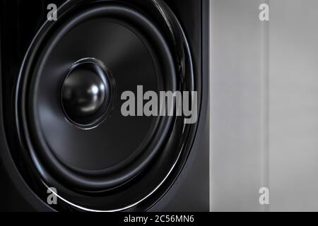 Black speaker of an acoustic monitor close-up. Stock Photo