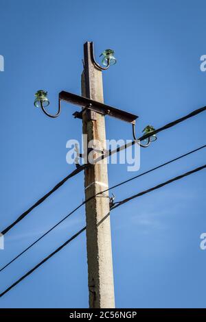 Rustic light pole against blue sky Stock Photo - Alamy