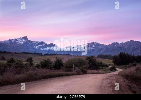 Tulbagh, South Africa - June 13th, 2020. Sunset scene of the snow covered mountains of the Cape Winelands District of South Africa. Stock Photo