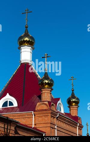 Golden dome with orthodox cross close-up on a blue sky background Stock ...