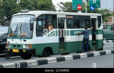 Jakarta, Indonesia - October 12, 2018: Kopaja bus in Tanah Abang district. Kopaja is private bus operators. Stock Photo