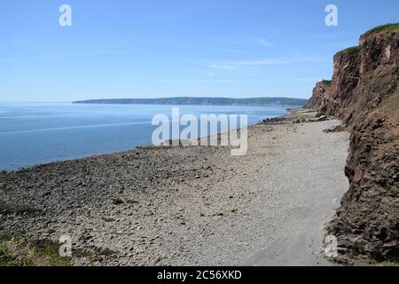 Rocky coastline of Nova Scotia, Canada under the blue sky Stock Photo