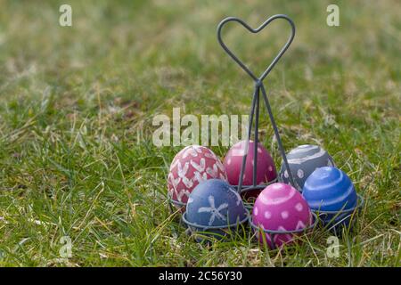 Nest of natural-colored Easter eggs in the garden Stock Photo