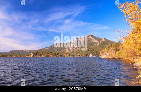 Majestic nature of Kazakhstan concept: epic view of Burabay lake with Okzhetpes and Zhumbaktas rocks at sunrise in autumn season Stock Photo