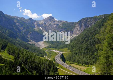 Tauern Autobahn A10 in front of the north portal of the Tauern tunnel with Radstädter Tauern and blue sky Stock Photo