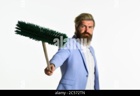 Global crisis and unemployment. Qualified. Personnel shifts. New responsibilities. Demotion concept. Crisis and unemployment. I agree to any work. Businessman hold broom. Financial crisis concept. Stock Photo