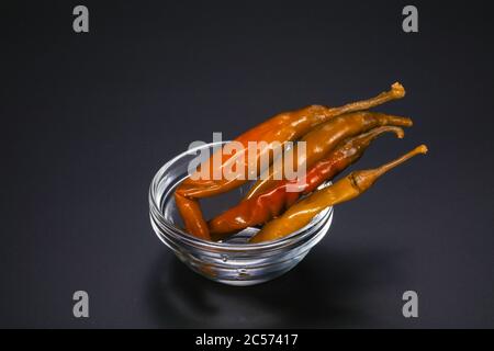 Marinated chilli pepper heap in the bowl Stock Photo