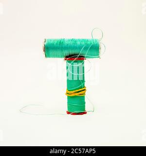 Bobbin of thread on a white background Stock Photo