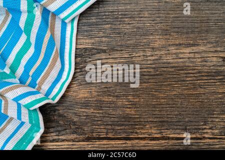 Blue checkered towel on the kitchen table. Wooden kitchen table. Stock Photo