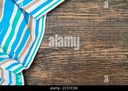 Blue checkered towel on the kitchen table. Wooden kitchen table. Stock Photo